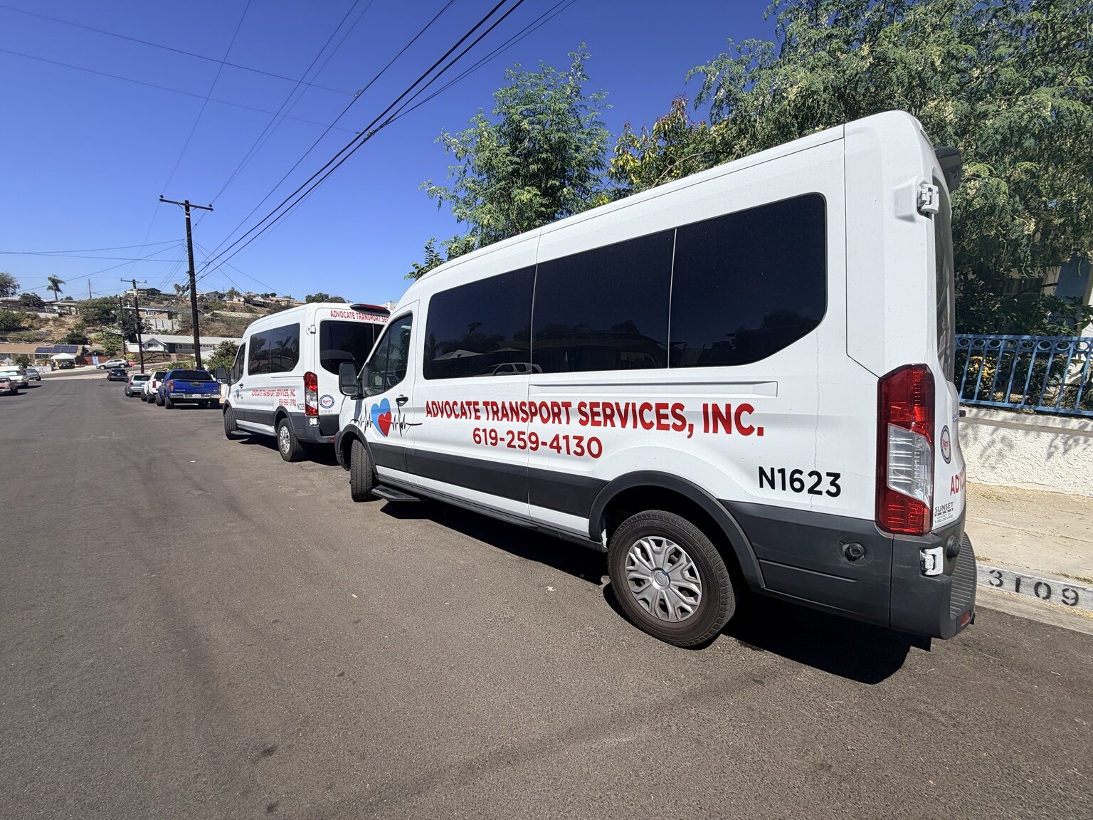 Advocate transport vans parked together in San Diego